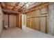 Unfinished basement with exposed ceiling, concrete floor, and framed walls ready for your custom design at 11186 E Baltic Dr, Aurora, CO 80014
