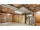 Unfinished basement with exposed utilities and concrete floor, offering a blank canvas for customization at 11186 E Baltic Dr, Aurora, CO 80014