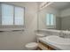 This bathroom features a window for natural light and a well-maintained toilet and vanity at 11186 E Baltic Dr, Aurora, CO 80014