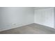 This bedroom boasts neutral carpeting, fresh white walls, and a spacious closet at 11186 E Baltic Dr, Aurora, CO 80014