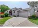 Charming home showcasing a well-maintained yard and inviting curb appeal with a two-car attached garage at 11186 E Baltic Dr, Aurora, CO 80014