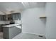 Bright kitchen area boasts gray cabinets, stainless steel appliances, and open floor plan at 11186 E Baltic Dr, Aurora, CO 80014
