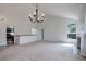 Open floor plan in living room showcasing natural light, fireplace, and access to the updated kitchen at 11186 E Baltic Dr, Aurora, CO 80014
