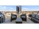 Relaxing outdoor balcony area with comfortable seating and a grill, perfect for enjoying city views at 2020 Arapahoe St # 1250, Denver, CO 80205