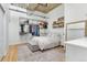 Light-filled bedroom with ample closet space, storage bench, open storage, and a large mirror at 2020 Arapahoe St # 1250, Denver, CO 80205