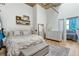 Bright bedroom with hardwood floors and a large dresser and an adjacent bedroom space at 2020 Arapahoe St # 1250, Denver, CO 80205