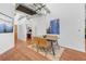 Contemporary dining room features modern lighting, decorative rug, and hardwood floors at 2020 Arapahoe St # 1250, Denver, CO 80205