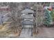 Aerial view of the home showing mature trees, concrete driveway, and well manicured landscaping at 1590 S Milwaukee St, Denver, CO 80210