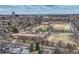 Aerial view of the neighborhood featuring many homes, schools, and baseball fields at 1590 S Milwaukee St, Denver, CO 80210