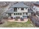 Backyard view featuring a patio with dining area and bench and a partial view of the home at 1590 S Milwaukee St, Denver, CO 80210