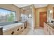 Luxurious bathroom with a soaking tub, glass-enclosed shower, and granite countertops at 1590 S Milwaukee St, Denver, CO 80210