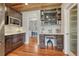 Kitchen with wooden ceiling, built in desk, stainless steel appliances, white countertops and hardwood floors at 1590 S Milwaukee St, Denver, CO 80210
