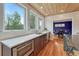 Kitchen with wooden ceiling, white countertops, stainless steel appliances, and hardwood floors at 1590 S Milwaukee St, Denver, CO 80210