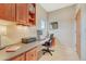 Functional home office space with built-in shelves, a desk, and natural light at 1590 S Milwaukee St, Denver, CO 80210