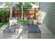 Charming backyard patio featuring lounge chairs, pillows, and a peaceful ambiance at 817 Uinta Way, Denver, CO 80230