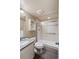 Bathroom featuring a stand-up shower with glass doors, granite countertops, and tiled floors at 817 Uinta Way, Denver, CO 80230