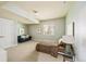 Cozy bedroom with comfortable seating, neutral walls, and bright window for a relaxing atmosphere at 817 Uinta Way, Denver, CO 80230