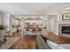 Spacious, open-concept kitchen and living room with modern appliances and fireplace at 817 Uinta Way, Denver, CO 80230