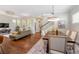 Open living space featuring hardwood floors, dining area, and comfortable seating at 817 Uinta Way, Denver, CO 80230