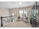 Upstairs loft features seating area and large windows at 817 Uinta Way, Denver, CO 80230