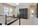 Upstairs loft area with a seating area, built-in shelving, and bright windows at 817 Uinta Way, Denver, CO 80230