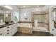 This main bathroom features a large bathtub, walk-in glass shower, and vanity with a granite countertop at 817 Uinta Way, Denver, CO 80230