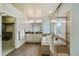 A spacious main bathroom features a walk-in shower, soaking tub, double vanity, and walk-in closet at 817 Uinta Way, Denver, CO 80230