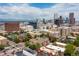 Beautiful aerial view of Denver skyline featuring brick apartment building at 1100 N Grant St # 208, Denver, CO 80203