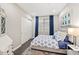Cozy bedroom featuring a comfortable bed, stylish rug, and ample natural light at 1100 N Grant St # 208, Denver, CO 80203