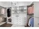 Spacious walk-in closet with custom shelving, drawers, and clothing racks for optimal organization at 1100 N Grant St # 208, Denver, CO 80203
