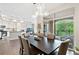 Open dining area with access to balcony overlooking kitchen and living area at 1100 N Grant St # 208, Denver, CO 80203