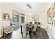 Bright dining room with modern lighting, access to a balcony, and stylish decor at 1100 N Grant St # 208, Denver, CO 80203