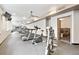 Community gym featuring cardio machines, ceiling fans and a bathroom in the corner at 1100 N Grant St # 208, Denver, CO 80203