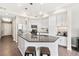 Stylish kitchen with granite countertops, white cabinets, stainless steel appliances, and island seating at 1100 N Grant St # 208, Denver, CO 80203