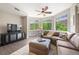 Cozy living room with plush seating, large windows, and stylish decor at 1100 N Grant St # 208, Denver, CO 80203