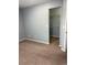 Empty bedroom with carpet and a walk-in closet at 5552 Flanders Way, Denver, CO 80249