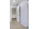 A view into the bedroom featuring neutral-toned walls, carpeted floors, and an open doorframe at 5552 Flanders Way, Denver, CO 80249