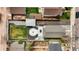 Aerial view of the property, highlighting the backyard, fire pit, lawn, and surrounding neighborhood at 134 N 6Th Ave, Brighton, CO 80601
