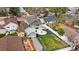 Overhead view of the home, backyard, white privacy fence, fire pit, and detached garage at 134 N 6Th Ave, Brighton, CO 80601