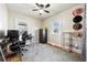 Bedroom featuring plush carpet, ceiling fan, two windows and a security safe at 134 N 6Th Ave, Brighton, CO 80601