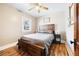 Cozy bedroom features wood-look flooring, ceiling fan and a comfortable-looking bed at 134 N 6Th Ave, Brighton, CO 80601