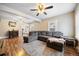 Comfortable living room with hardwood floors, a ceiling fan, and large sectional sofa at 134 N 6Th Ave, Brighton, CO 80601