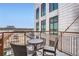 Relaxing balcony space with chairs and a view of the cityscape at 3100 Huron St # 3E, Denver, CO 80202