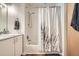 Clean bathroom featuring tub and shower combination, modern vanity with storage at 3100 Huron St # 3E, Denver, CO 80202