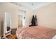 Comfortable bedroom with full length mirror and open doorway to main living area at 3100 Huron St # 3E, Denver, CO 80202