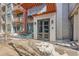 Attractive entryway showcasing the building name, a seating area, and the address of the building at 3100 Huron St # 3E, Denver, CO 80202