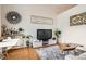Bright living space with hardwood flooring, contemporary decor, and stylish furnishings create a cozy atmosphere at 3100 Huron St # 3E, Denver, CO 80202