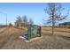 A City of Cuernavaca Park sign stands on a grassy lawn with trees, walkways, and buildings in the background at 3100 Huron St # 3E, Denver, CO 80202