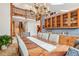 Elegant dining room with unique copper top table and chandelier at 29477 Blue Moon Dr, Evergreen, CO 80439