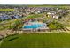Aerial view of community pool and amenities in a neighborhood with green space at 10295 E 59Th Ave, Denver, CO 80238